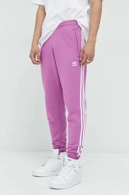 Zdjęcie produktu adidas Originals spodnie dresowe męskie kolor różowy z aplikacją