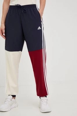 Zdjęcie produktu adidas spodnie dresowe Essentials damskie kolor granatowy wzorzyste