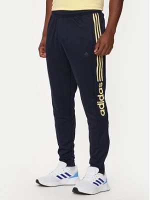 Zdjęcie produktu adidas Spodnie dresowe Tiro Wordmark IW5997 Granatowy Regular Fit