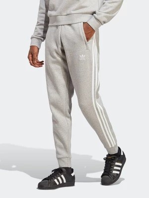 Zdjęcie produktu adidas Spodnie dresowe w kolorze szarym rozmiar: XS