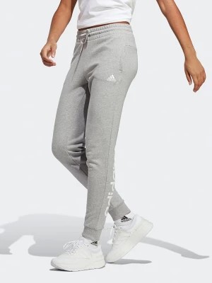 Zdjęcie produktu adidas Spodnie dresowe w kolorze szarym rozmiar: XL