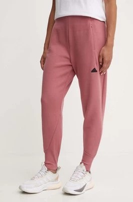Zdjęcie produktu adidas spodnie dresowe ZNE kolor różowy gładkie IW7771