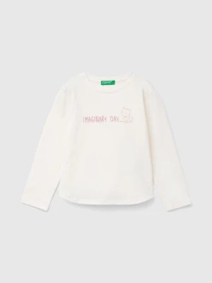 Zdjęcie produktu Benetton, Organic Cotton T-shirt With Glittery Print, size 82, Creamy White, Kids United Colors of Benetton