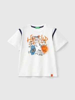 Zdjęcie produktu Benetton, T-shirt With Graffiti Print In Organic Cotton, size 116, White, Kids United Colors of Benetton