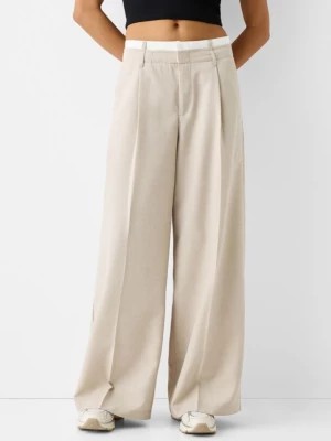 Zdjęcie produktu Bershka Eleganckie Spodnie Wide Leg Z Kontrastowym Elementem W Talii Kobieta Wielbłądzi