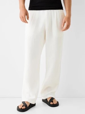 Zdjęcie produktu Bershka Strukturalne Spodnie Rustykalne Wide Leg Mężczyzna Biały Złamany