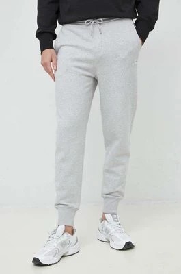 Zdjęcie produktu Calvin Klein Jeans spodnie dresowe bawełniane męskie kolor szary gładkie