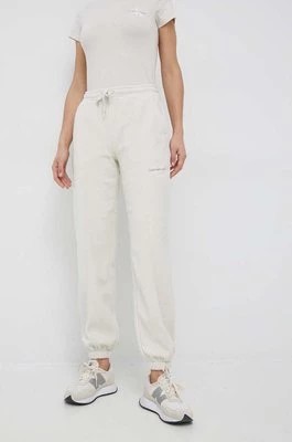 Zdjęcie produktu Calvin Klein Jeans spodnie dresowe damskie kolor beżowy z aplikacją
