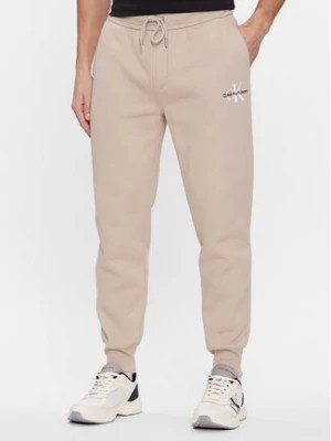 Zdjęcie produktu Calvin Klein Jeans Spodnie dresowe Monologo J30J324685 Beżowy Regular Fit