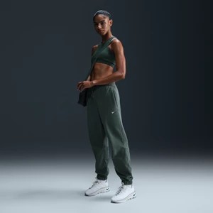 Zdjęcie produktu Damskie luźne spodnie z dzianiny Nike Therma-FIT - Zieleń