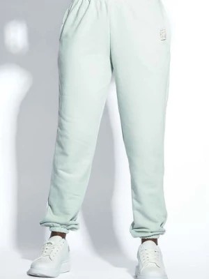 Zdjęcie produktu Damskie spodnie dresowe pistacjowe z kieszeniami Fobya