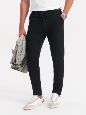 Zdjęcie produktu Dzianinowe spodnie męskie z gumką w pasie - czarne V4 OM-PACP-0116
 -                                    XL