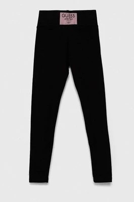 Zdjęcie produktu Guess legginsy dziecięce kolor czarny gładkie