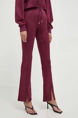 Zdjęcie produktu Guess spodnie dresowe kolor fioletowy gładkie