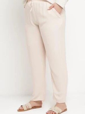 Zdjęcie produktu Jasnobeżowe Casualowe Spodnie z Elastyczną Gumką w Pasie z Wsuwanymi Kieszeniami Mousesa
