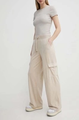 Zdjęcie produktu Juicy Couture spodnie dresowe welurowe kolor beżowy z aplikacją