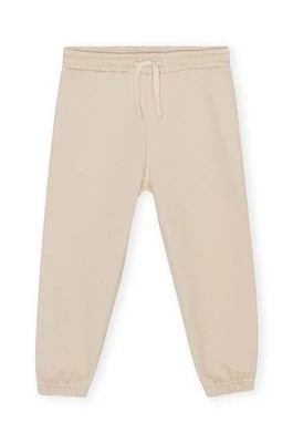 Zdjęcie produktu Konges Sløjd spodnie dresowe dziecięce kolor beżowy gładkie