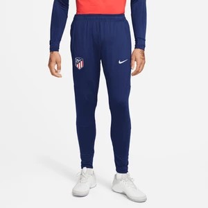Zdjęcie produktu Męskie dzianinowe spodnie piłkarskie Atlético Madryt Strike Nike Dri-FIT - Niebieski