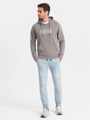 Zdjęcie produktu Męskie spodnie jeansowe JOGGERY z przetarciami - jasnoniebieskie V1 OM-PADJ-0150
 -                                    S
