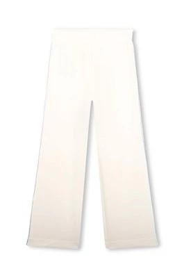 Zdjęcie produktu Michael Kors spodnie dresowe dziecięce kolor beżowy z aplikacją