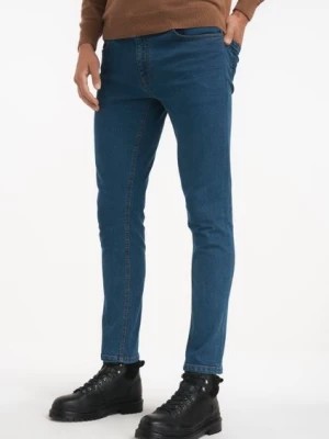 Zdjęcie produktu Niebieskie jeansy męskie OCHNIK
