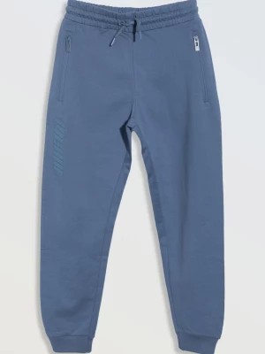 Zdjęcie produktu Niebieskie spodnie dresowe z kieszeniami zapinanymi na zamek