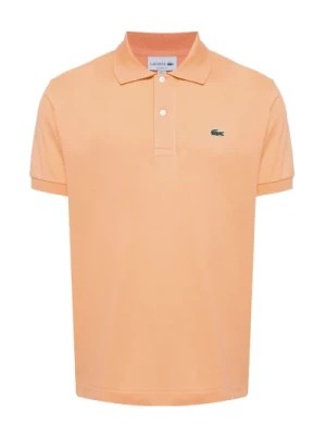 Zdjęcie produktu Polo w kolorze pomarańczowym z aplikacją logo Lacoste