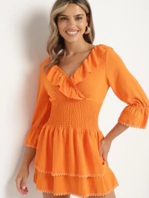 Zdjęcie produktu Pomarańczowa Sukienka z Kopertowym Dekoltem i Gumką w Pasie Ozdobiona Falbanką Tesalie