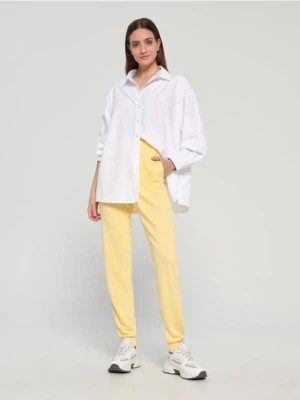 Zdjęcie produktu Sinsay - Spodnie dresowe basic - żółty
