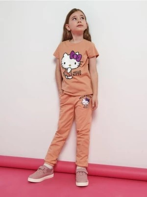 Zdjęcie produktu Sinsay - Spodnie dresowe Hello Kitty - pomarańczowy