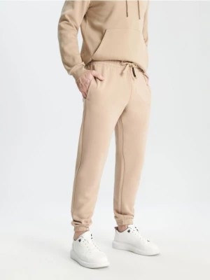 Zdjęcie produktu Sinsay - Spodnie dresowe jogger - beżowy