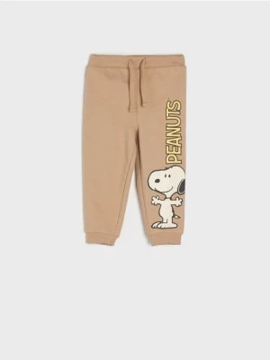 Zdjęcie produktu Sinsay - Spodnie dresowe jogger Snoopy - beżowy