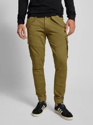 Zdjęcie produktu Spodnie cargo o kroju tapered fit z kieszeniami z patką model ‘COMBAT PANT’ alpha industries