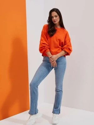 Zdjęcie produktu Spodnie damskie jeansowe z rozciętymi nogawkami Moodo