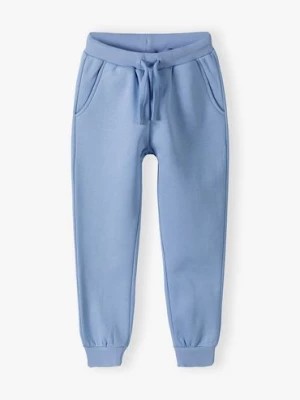 Zdjęcie produktu Spodnie dresowe dziewczęce niebieskie - Powerful #Family Family Concept by 5.10.15.