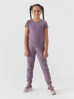 Zdjęcie produktu Spodnie dresowe joggery dziewczęce - fioletowe 4F JUNIOR