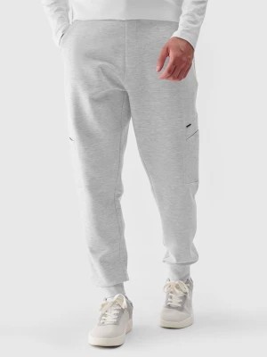 Zdjęcie produktu Spodnie dresowe joggery męskie - szare 4F