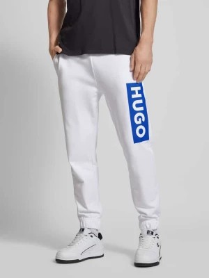 Zdjęcie produktu Spodnie dresowe o kroju regular fit z nadrukiem z logo model ‘Nuram’ Hugo Blue