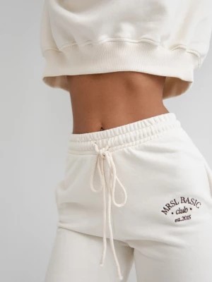 Zdjęcie produktu Spodnie dresowe z HAFTEM w kolorze LIGHT BEIGE - COOPER-L Marsala