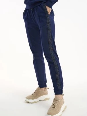Zdjęcie produktu Spodnie dresowe z lampasami damskie OCHNIK