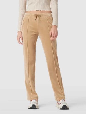 Zdjęcie produktu Spodnie dresowe z obszyciem kamieniami stras model ‘TINA’ Juicy Couture