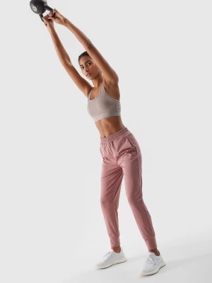 Zdjęcie produktu Spodnie treningowe szybkoschnące damskie - pudrowy róż 4F