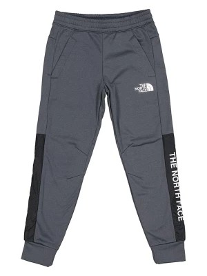 Zdjęcie produktu The North Face Spodnie sportowe "New Ampere" w kolorze szarym rozmiar: L