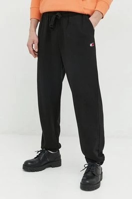 Zdjęcie produktu Tommy Jeans spodnie dresowe bawełniane męskie kolor czarny gładkie
